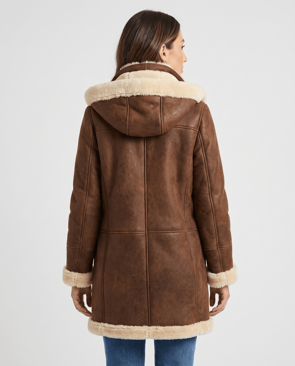 A dark brown shearling duffle coat with a hood and toggle zip closure, shown from the back
