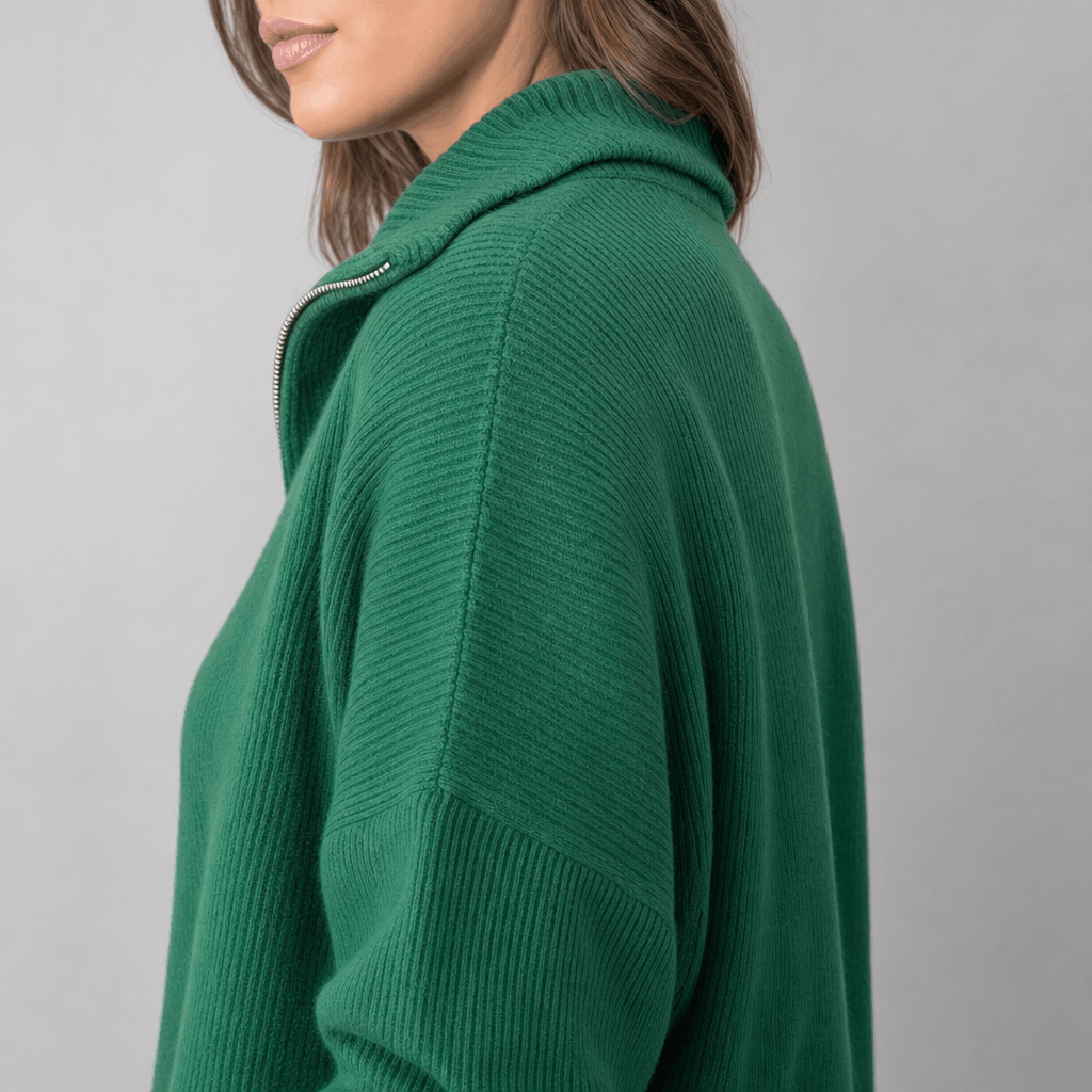 Side close-up showing the raised collar and ribbed texture of the forest green sweater.