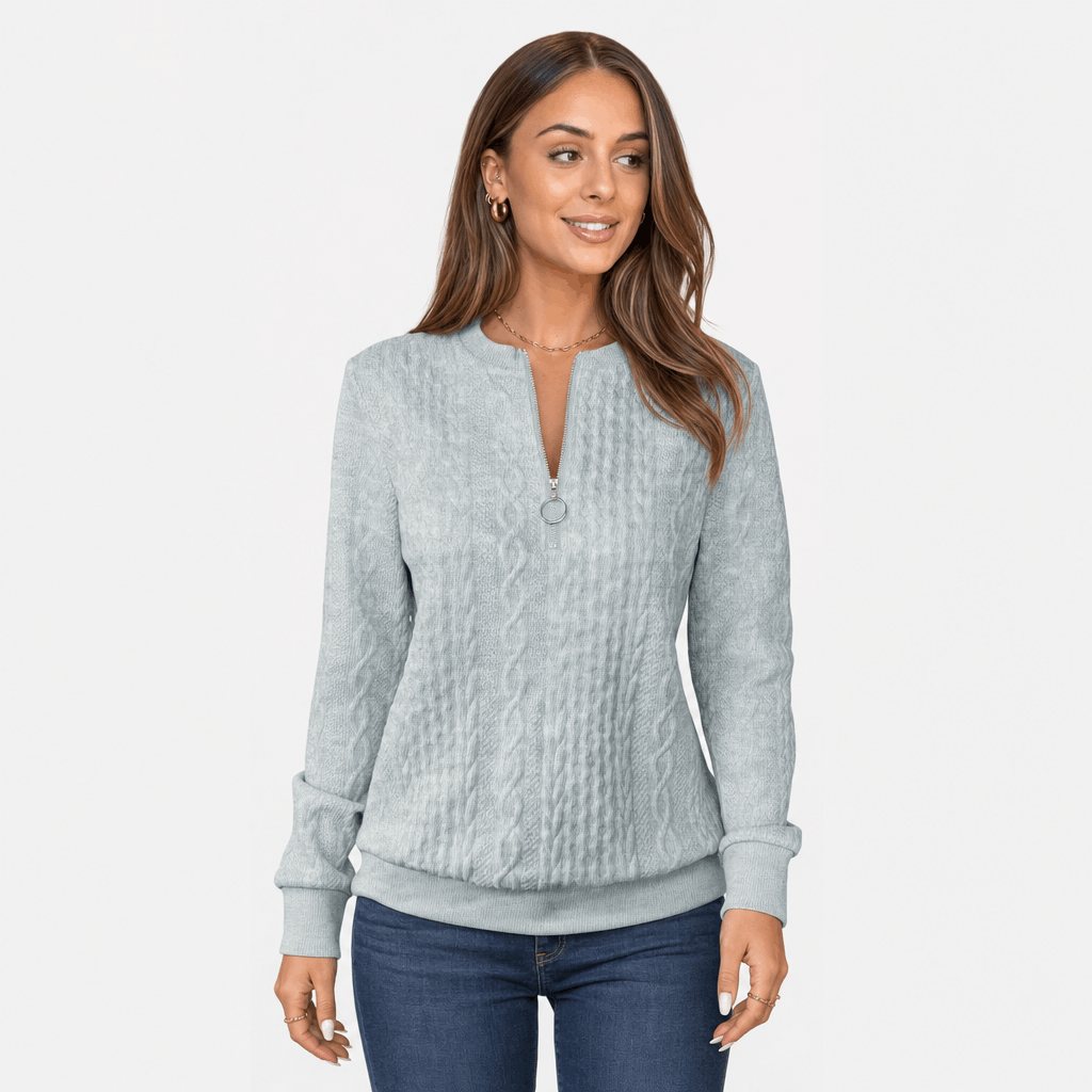 Close-up of the woman modeling the light gray sweater.
