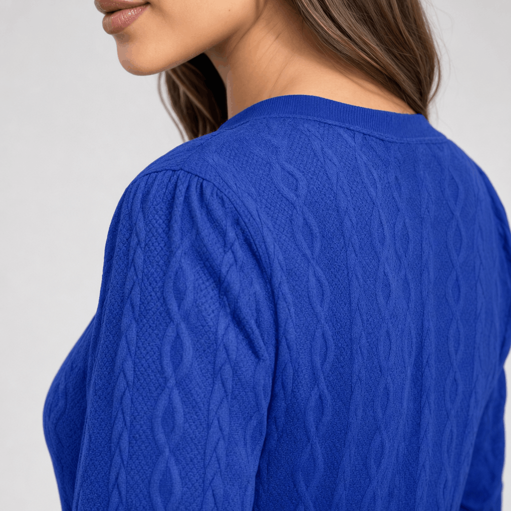 Back close-up showing the textured ribbed knit of the royal blue sweater.
