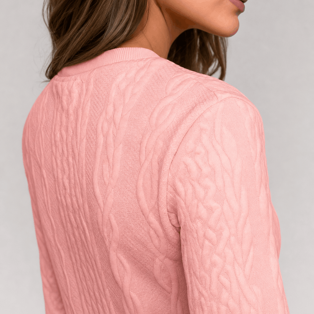 Back close-up showing the textured ribbed knit of the soft pink sweater.