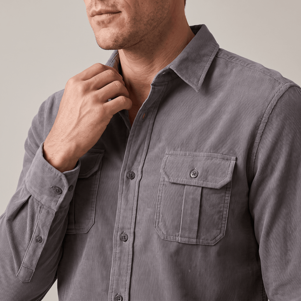 Grey fine-wale corduroy shirt featuring a spread collar and twin buttoned flap chest pockets in a regular fit.