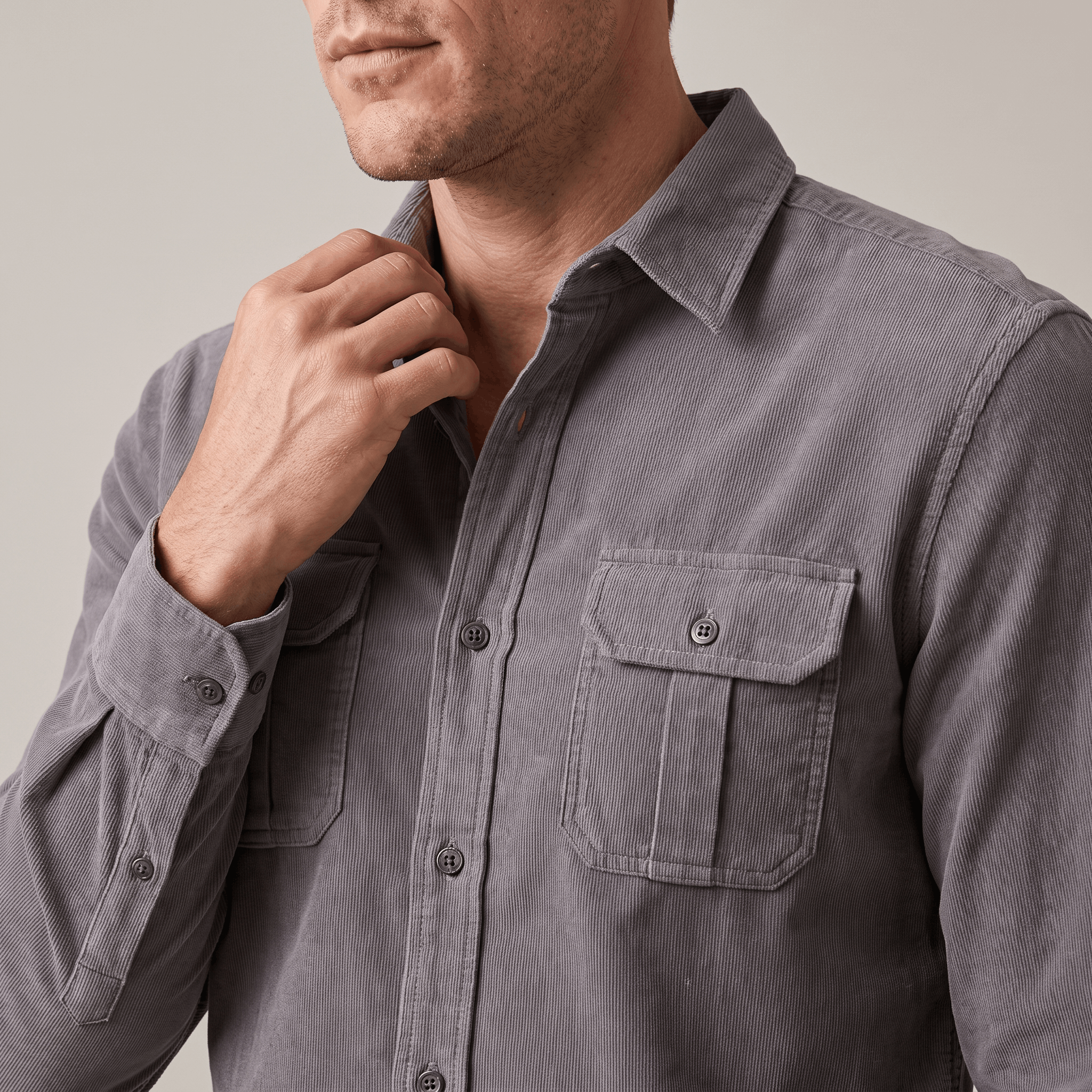 Grey fine-wale corduroy shirt featuring a spread collar and twin buttoned flap chest pockets in a regular fit.