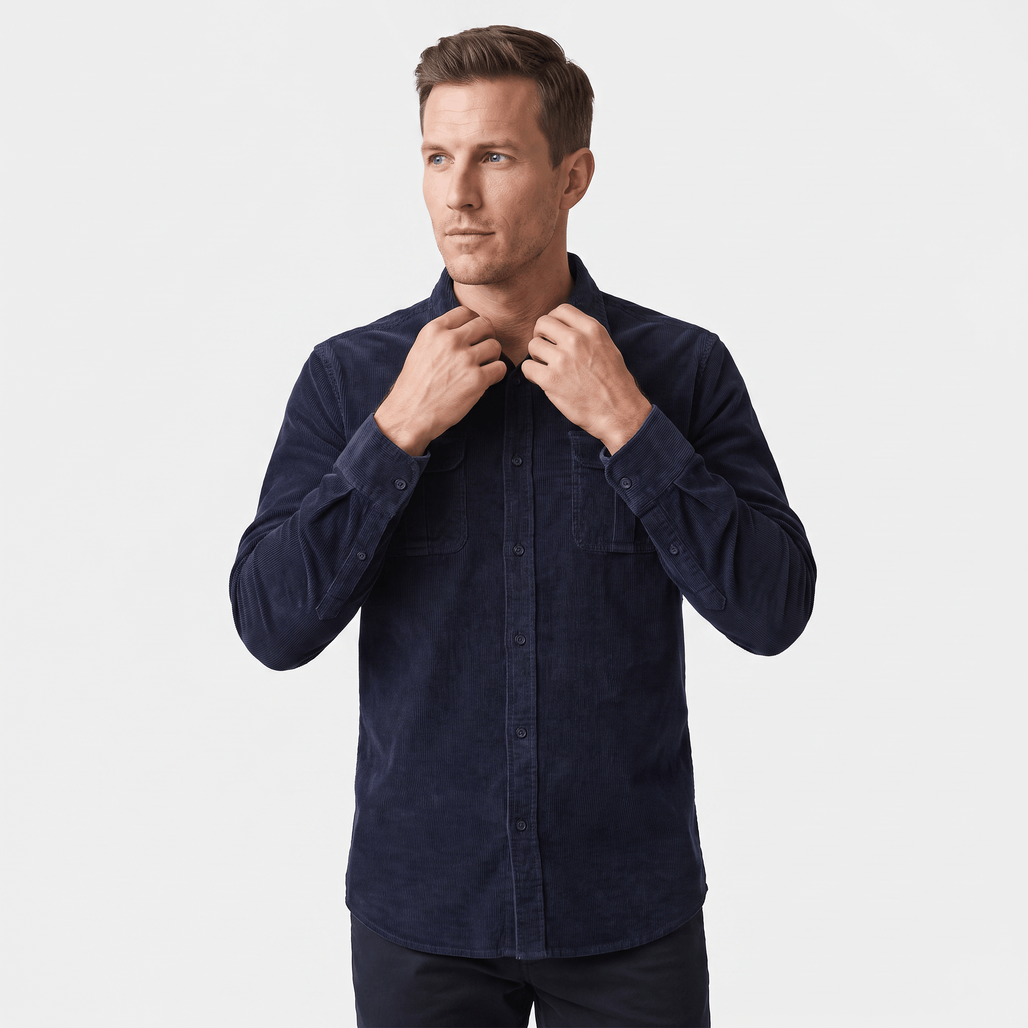 Navy blue fine-wale corduroy shirt with a spread collar and twin button-flap chest pockets in a regular fit.
