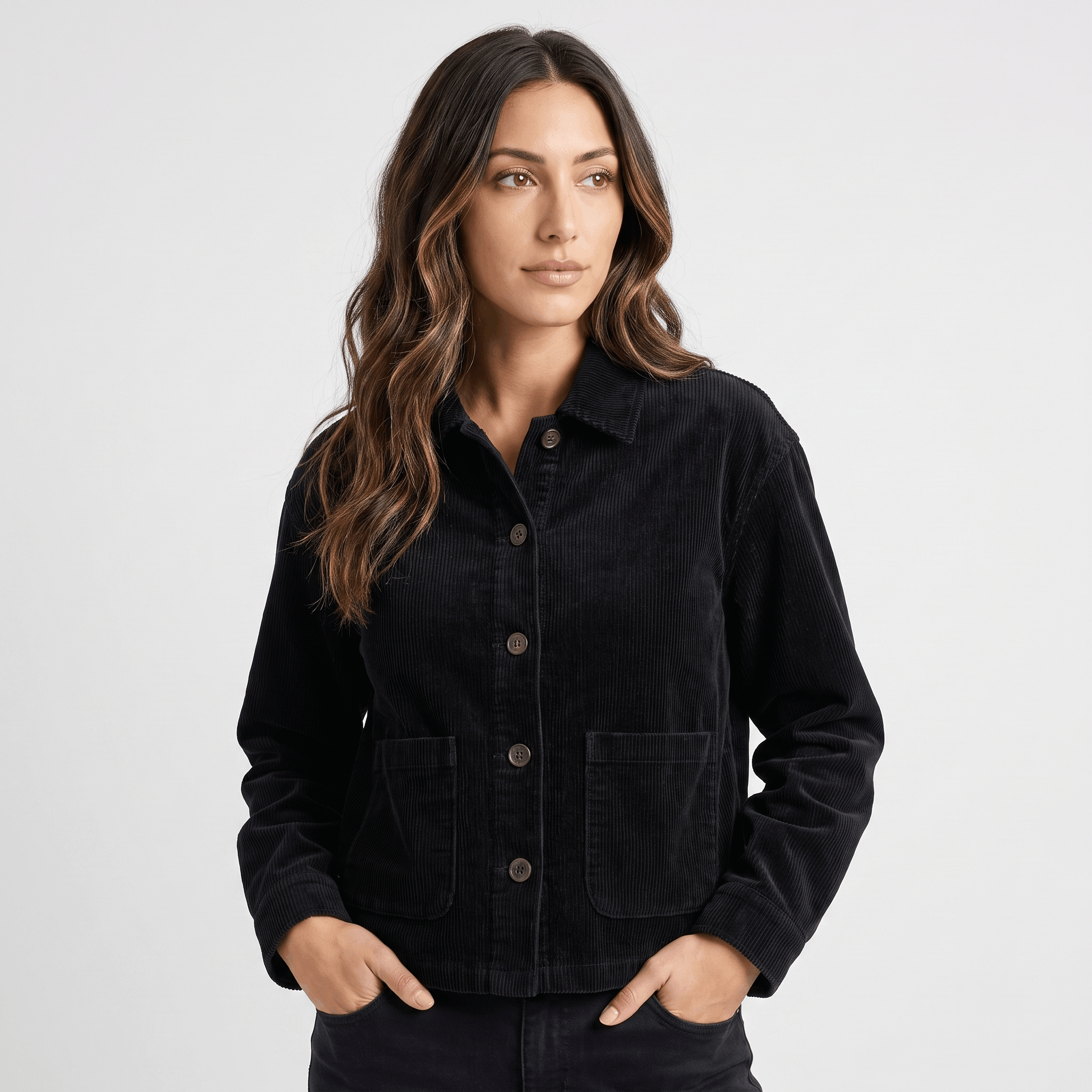 Black cotton corduroy chore jacket with a boxy fit, button-front closure, and deep patch pockets.