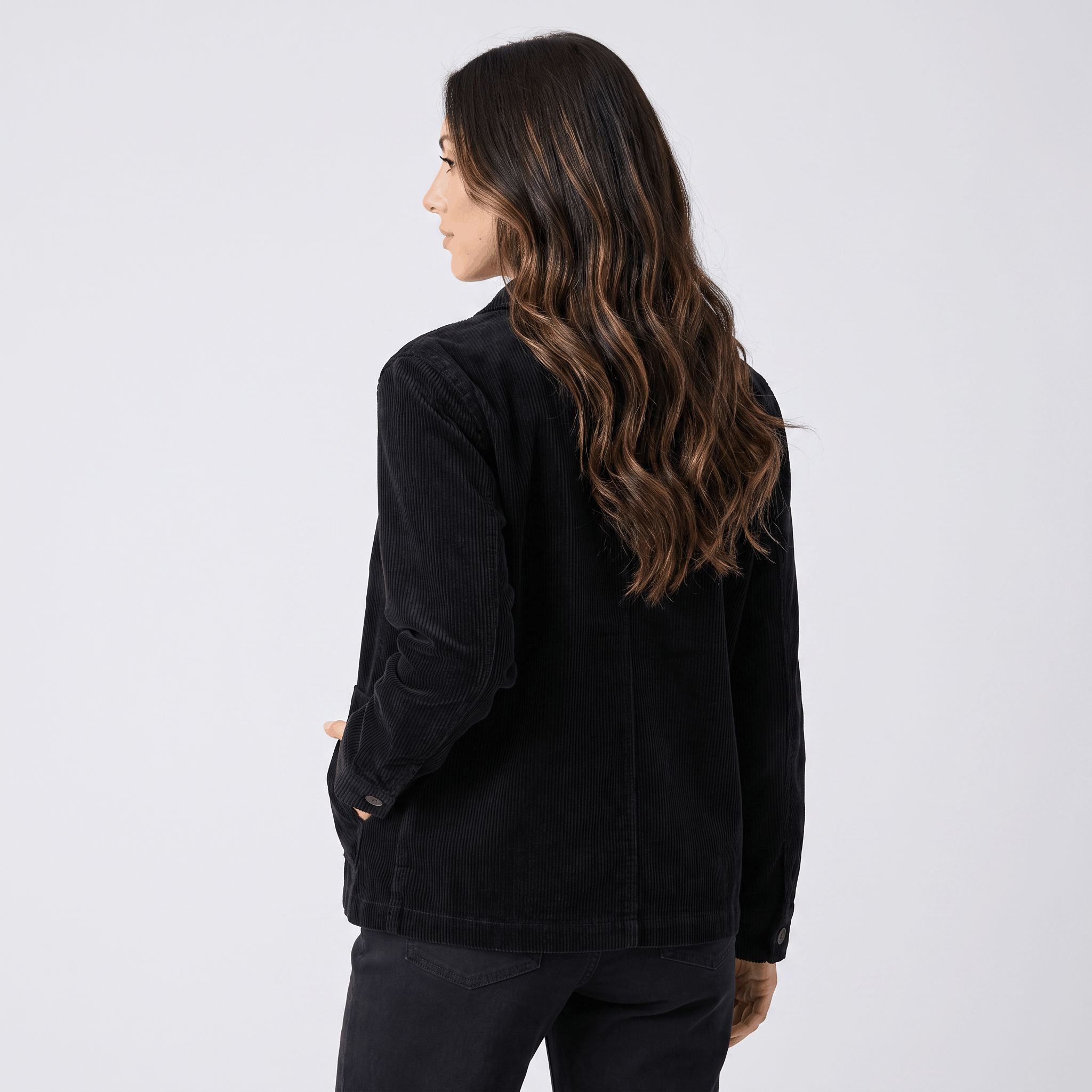 Black wide-wale cotton corduroy chore jacket with a boxy, straight-hem silhouette and deep hip patch pockets.