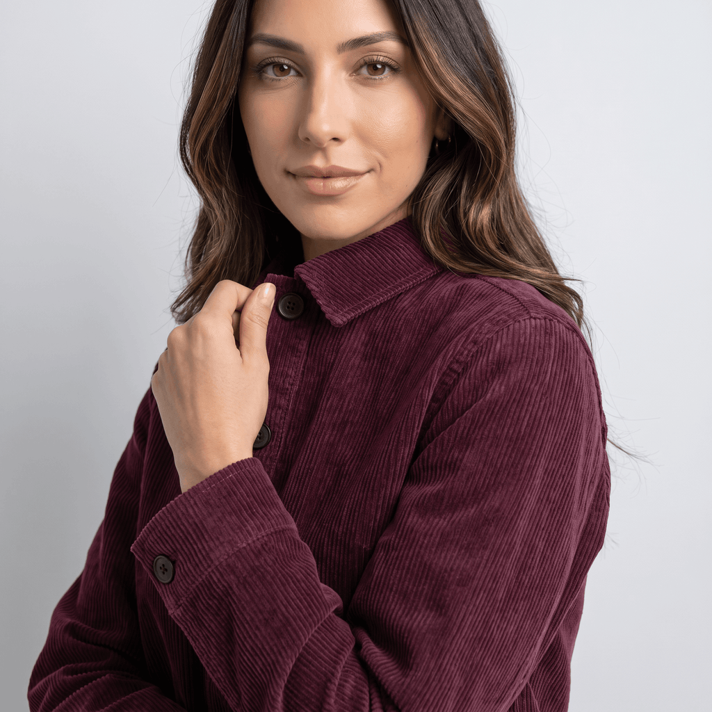Deep burgundy cotton corduroy chore jacket with a boxy fit, button-front closure, and structured collar.