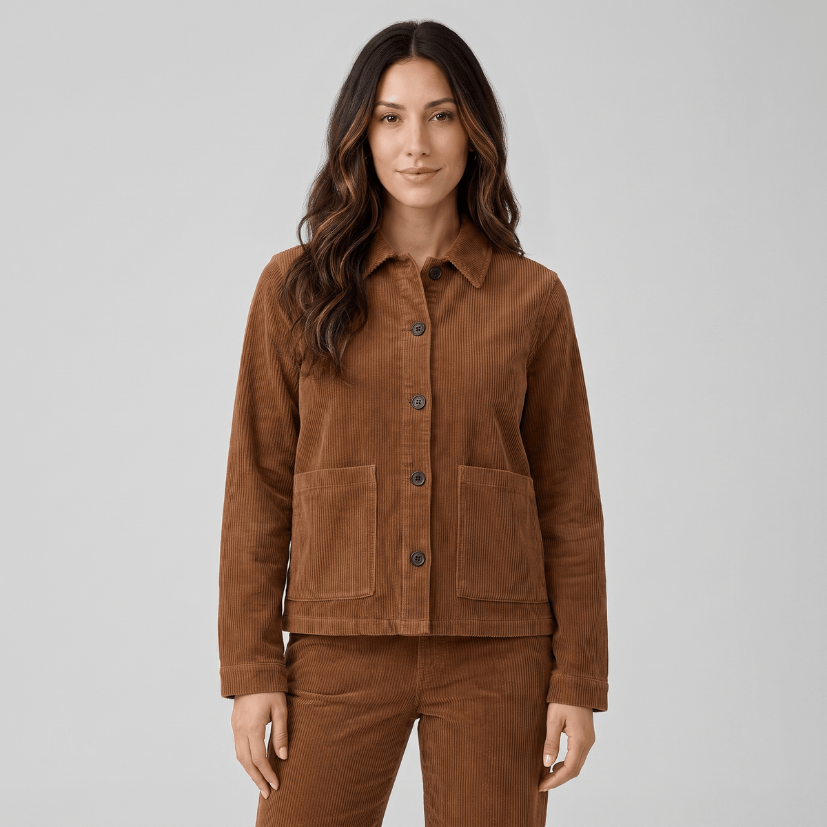 Brown wide wale cotton corduroy chore jacket with a boxy fit, button-front closure, and two deep patch pockets.