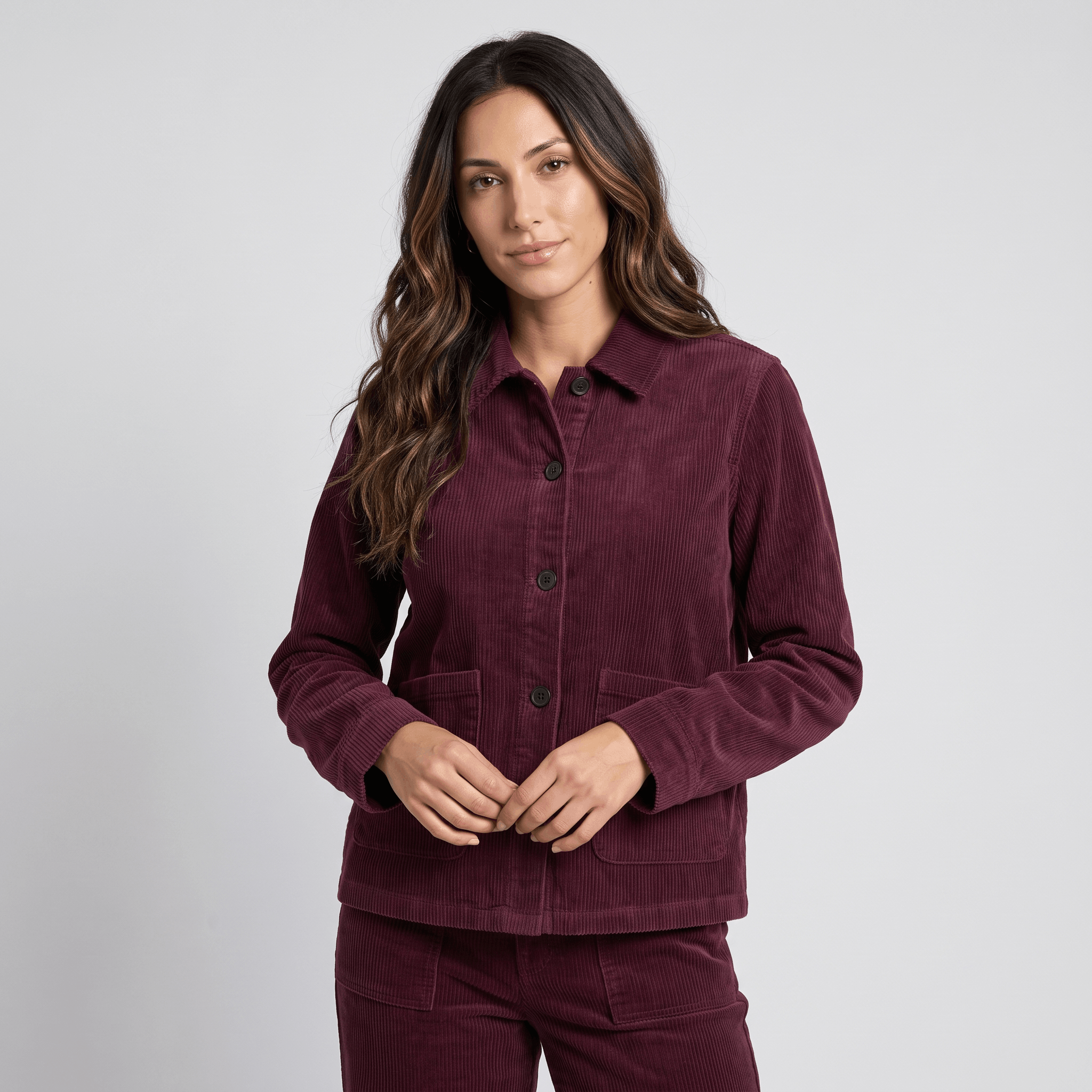 Deep burgundy cotton corduroy chore jacket with a boxy fit, button-front closure, and two large patch pockets.