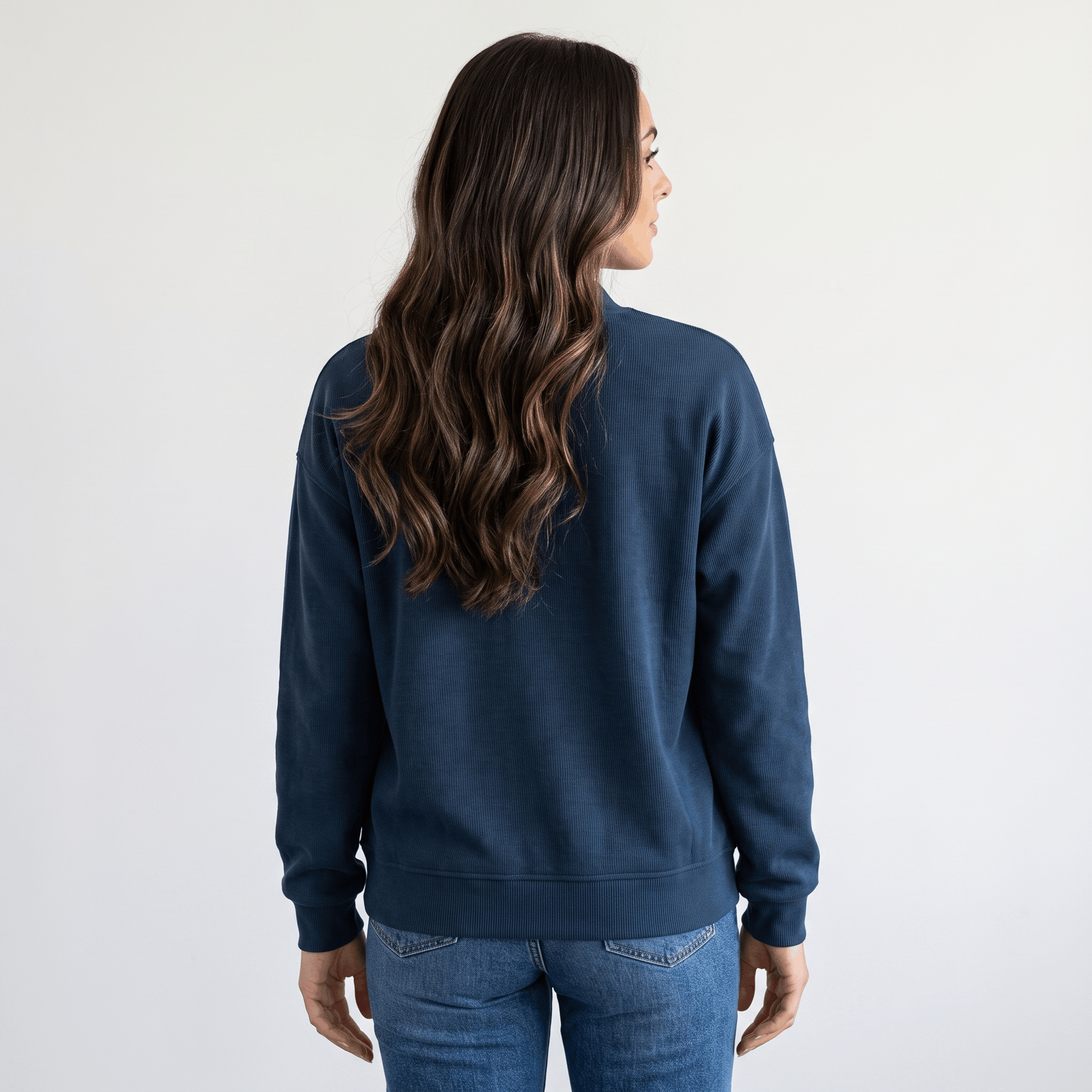 Female model wearing the navy blue jacket, showing the back and relaxed fit.