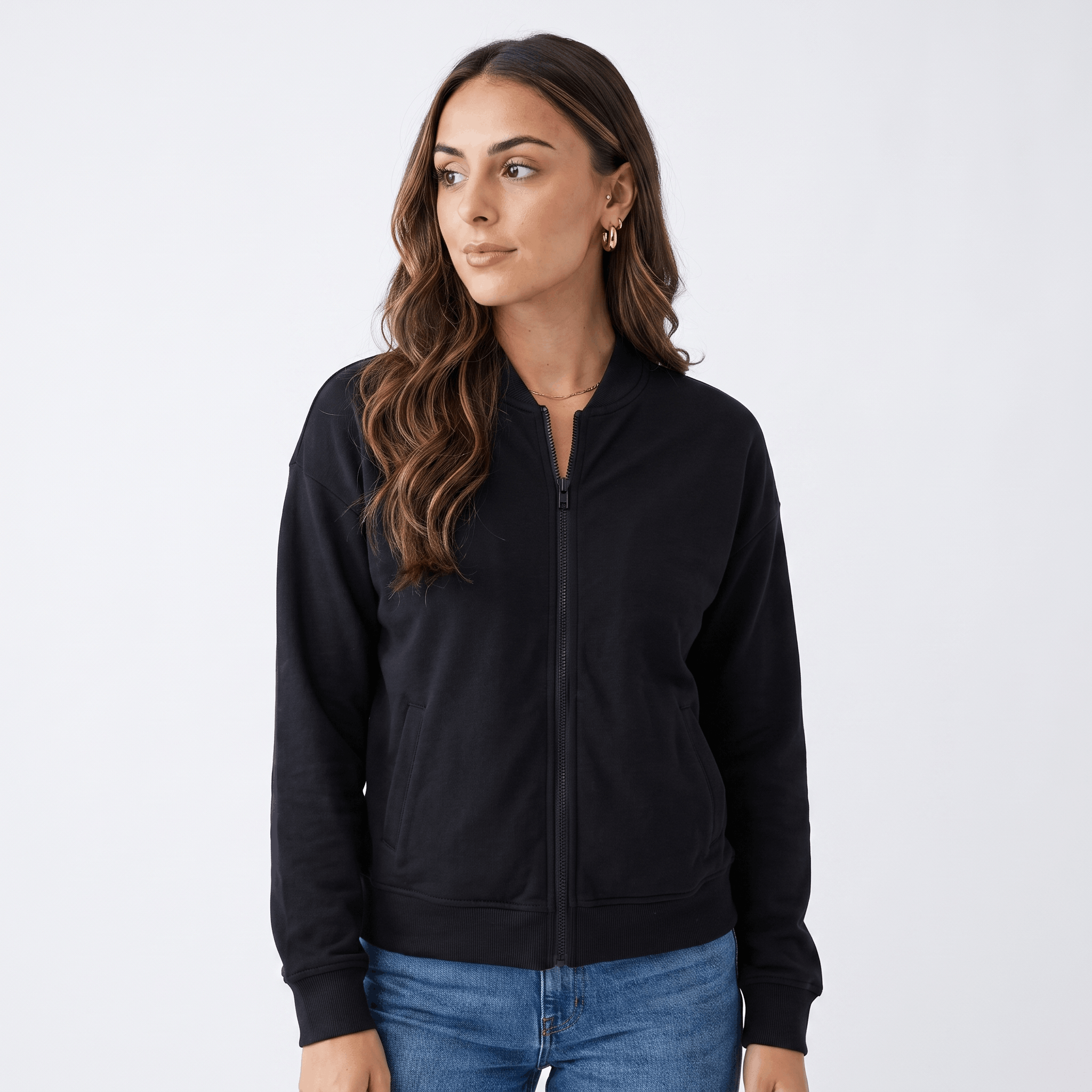 Female model wearing a black zip-up jacket with a stand collar and side pockets.