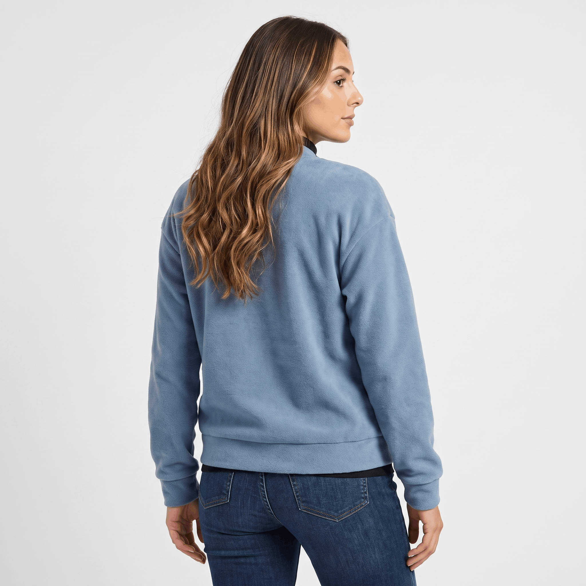 Female model wearing the light blue jacket, showing the back and relaxed fit.