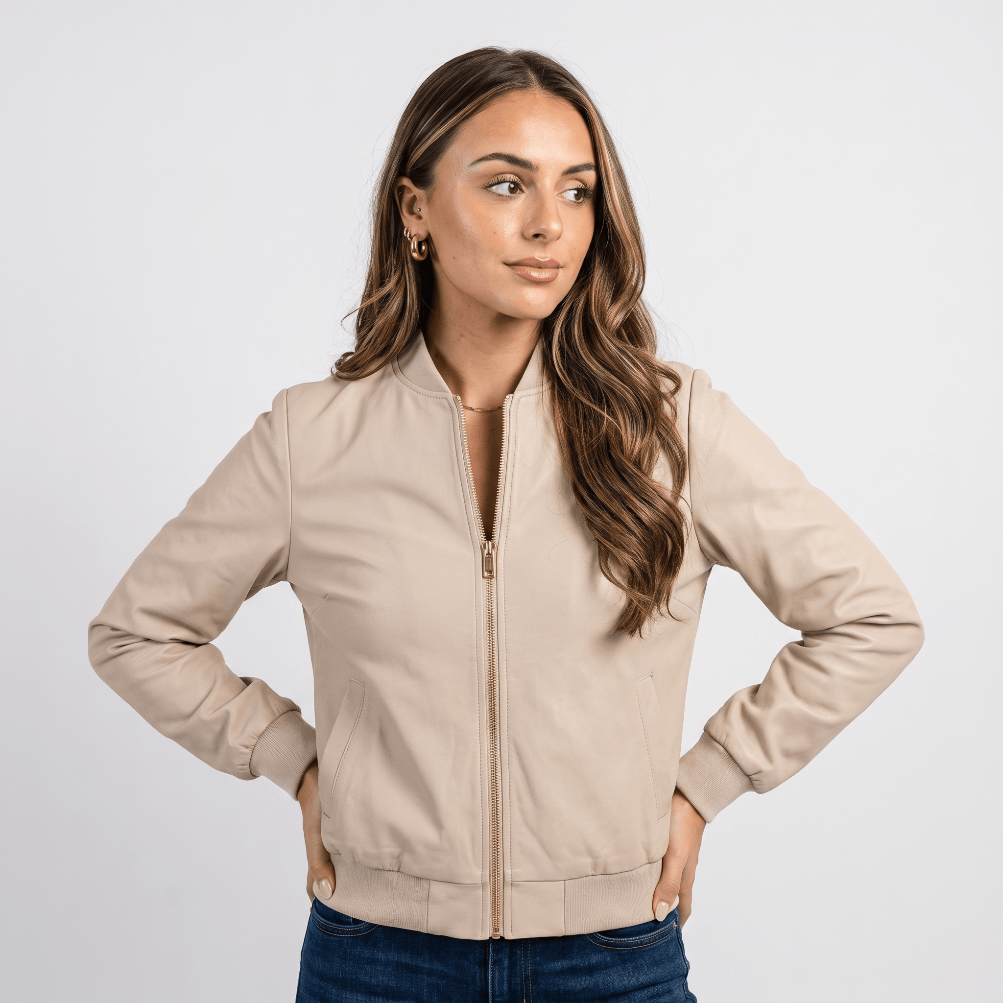 Female model wearing a cream beige zip-up jacket with a stand collar and side pockets.