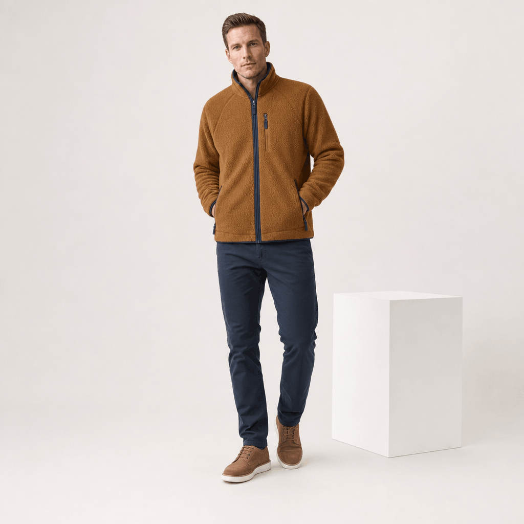 Male model wearing the brown zip-up fleece jacket with dark jeans.