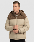 Man wearing khaki Dravon quilted puffer jacket, front view with corduroy hood and two-tone panels