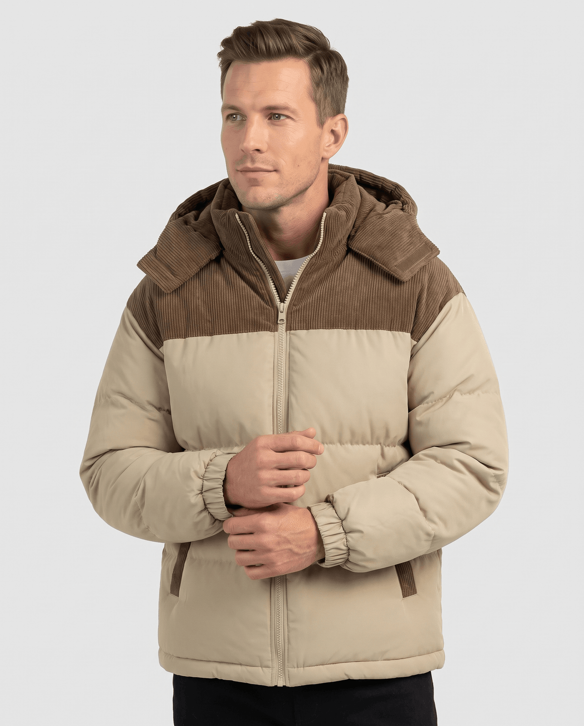 Man wearing khaki Dravon quilted puffer jacket, front view with corduroy hood and two-tone panels