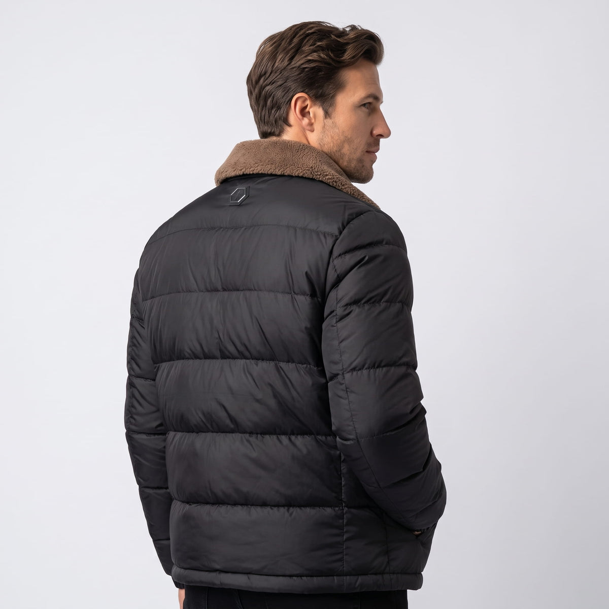 Black Julian insulated puffer jacket back view showing quilted panels and fleece collar