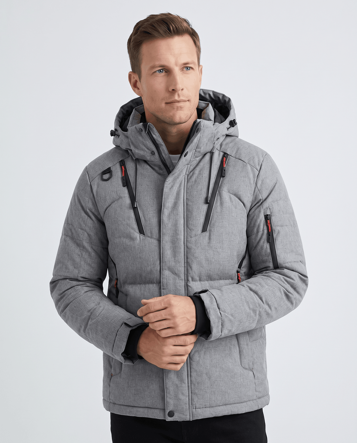 Man wearing gray Paolo hooded puffer jacket, front view showing multi-pocket utility design