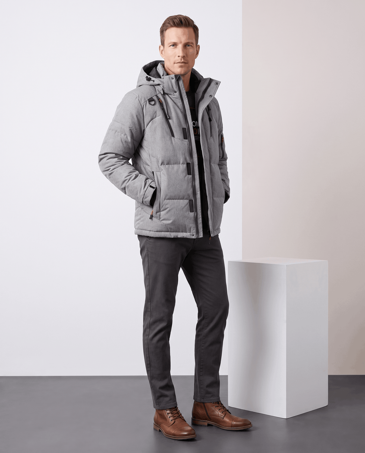 Man wearing gray Paolo hooded puffer jacket with trousers, full-length front view