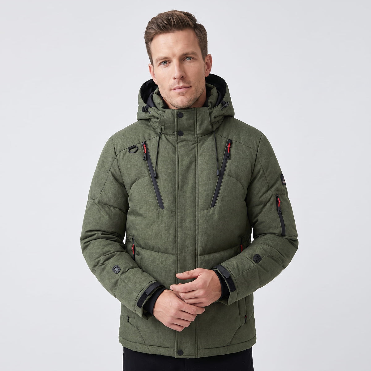 Man wearing green Paolo hooded puffer jacket, front view showing zip front and utility pockets