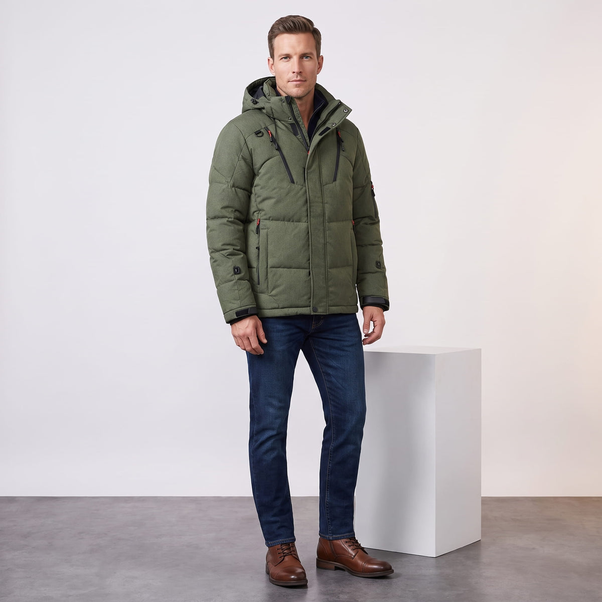 Man wearing green Paolo hooded puffer jacket with jeans, full-length front view