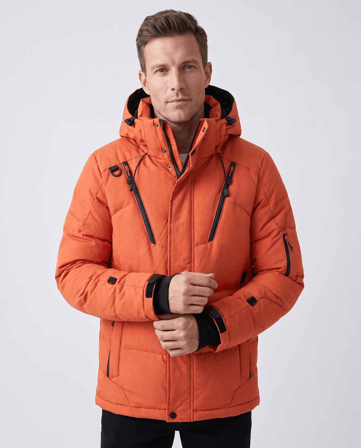 Man wearing orange Paolo hooded puffer jacket, front view showing zip front and pockets