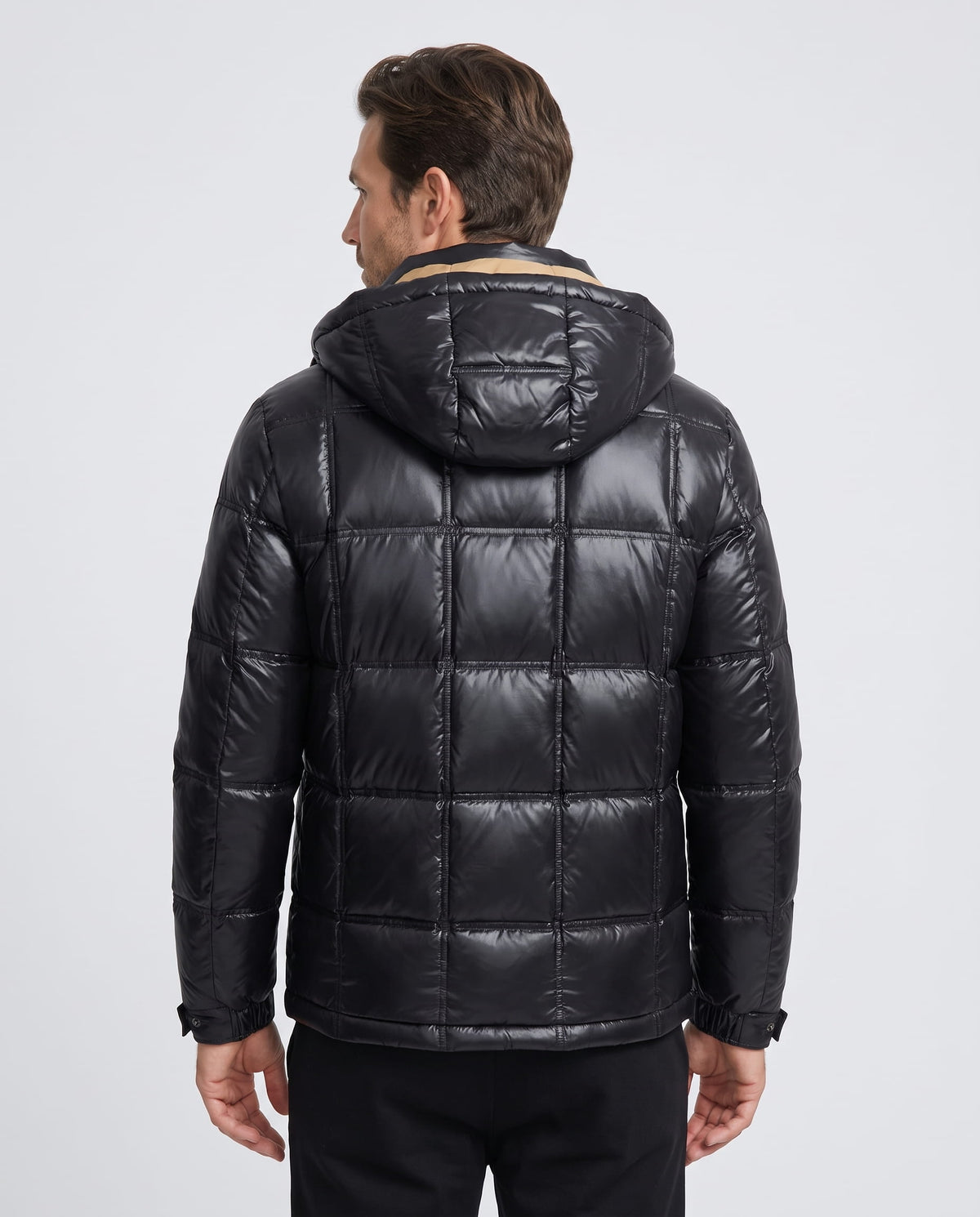 Black Robin hooded puffer jacket back view showing hood and quilted panels