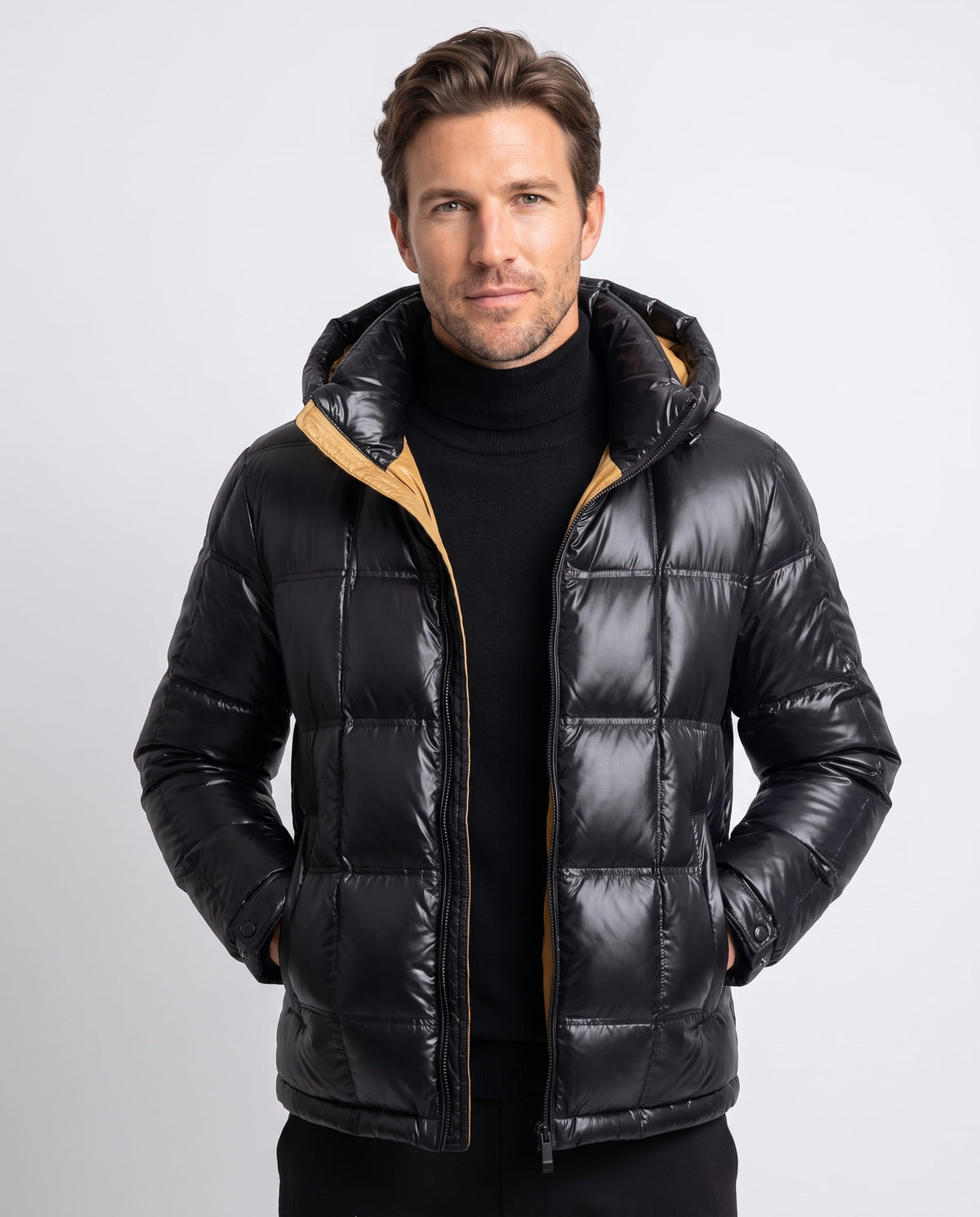 Man wearing black Robin down-filled puffer jacket, front view with contrast hood lining