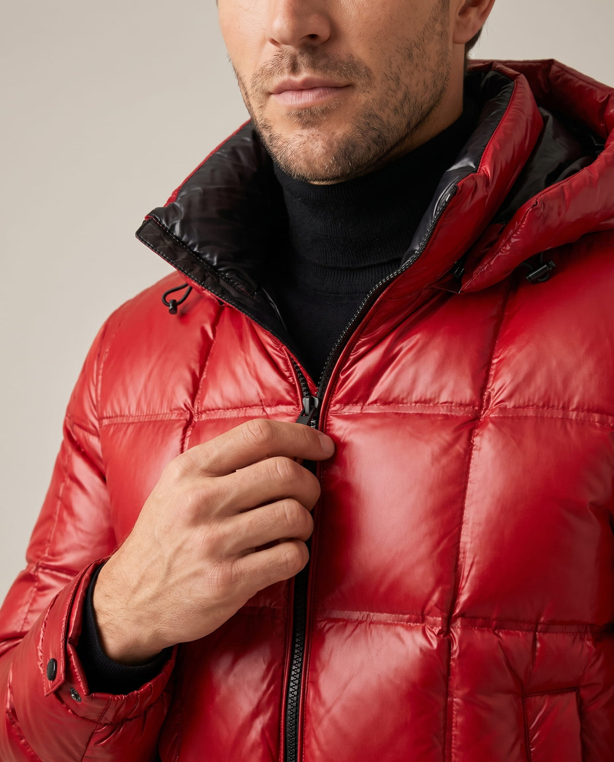 Close-up of red Robin puffer jacket collar, hood and water-resistant quilted shell