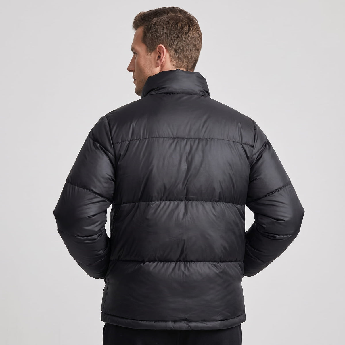 Black Salvador quilted puffer jacket back view showing insulated horizontal panels
