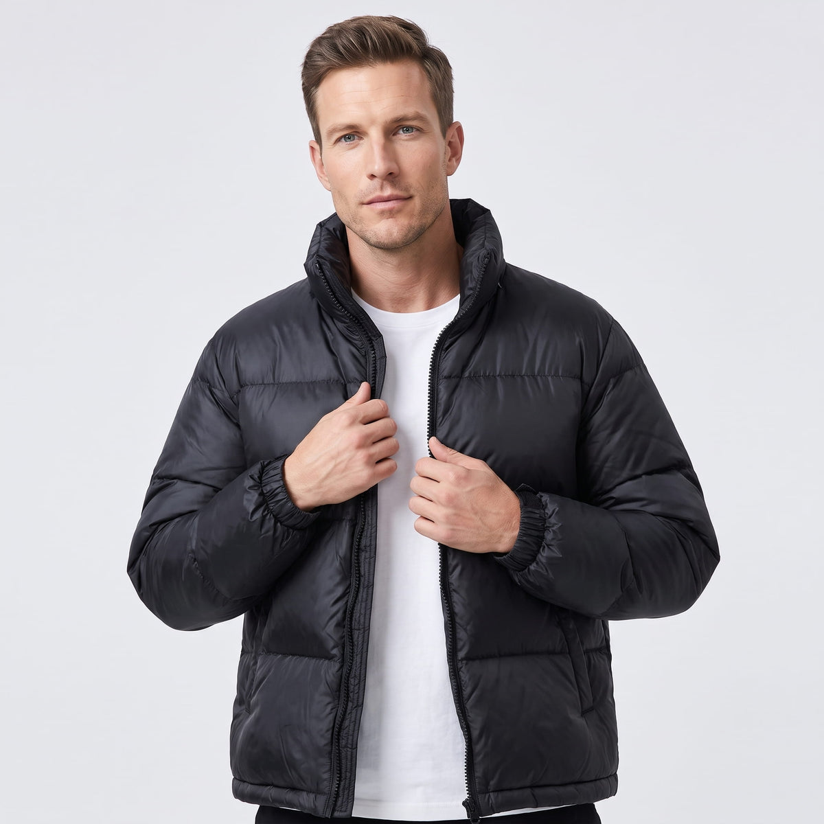 Man wearing black Salvador quilted puffer jacket, front view with full-zip and high collar