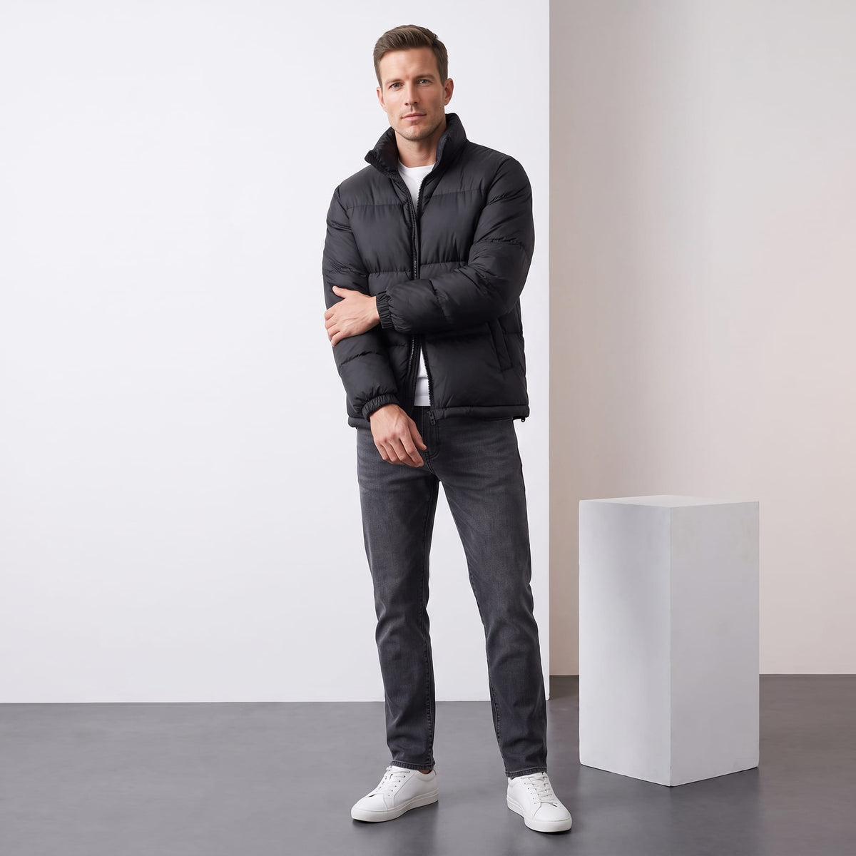 Man wearing black Salvador quilted puffer jacket with dark trousers, full-length front view