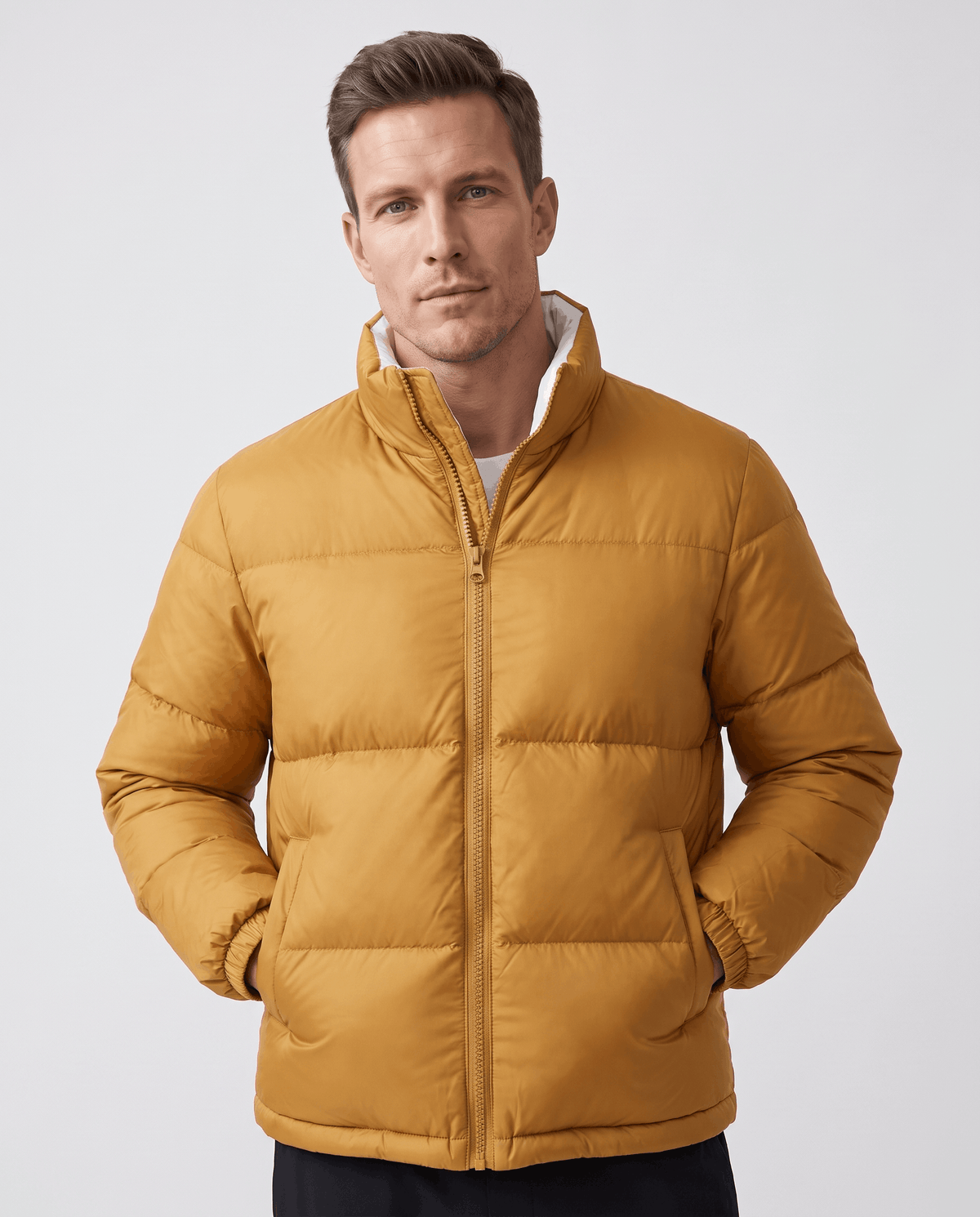 Man wearing caramel Salvador quilted puffer jacket, front view with full-zip and high collar