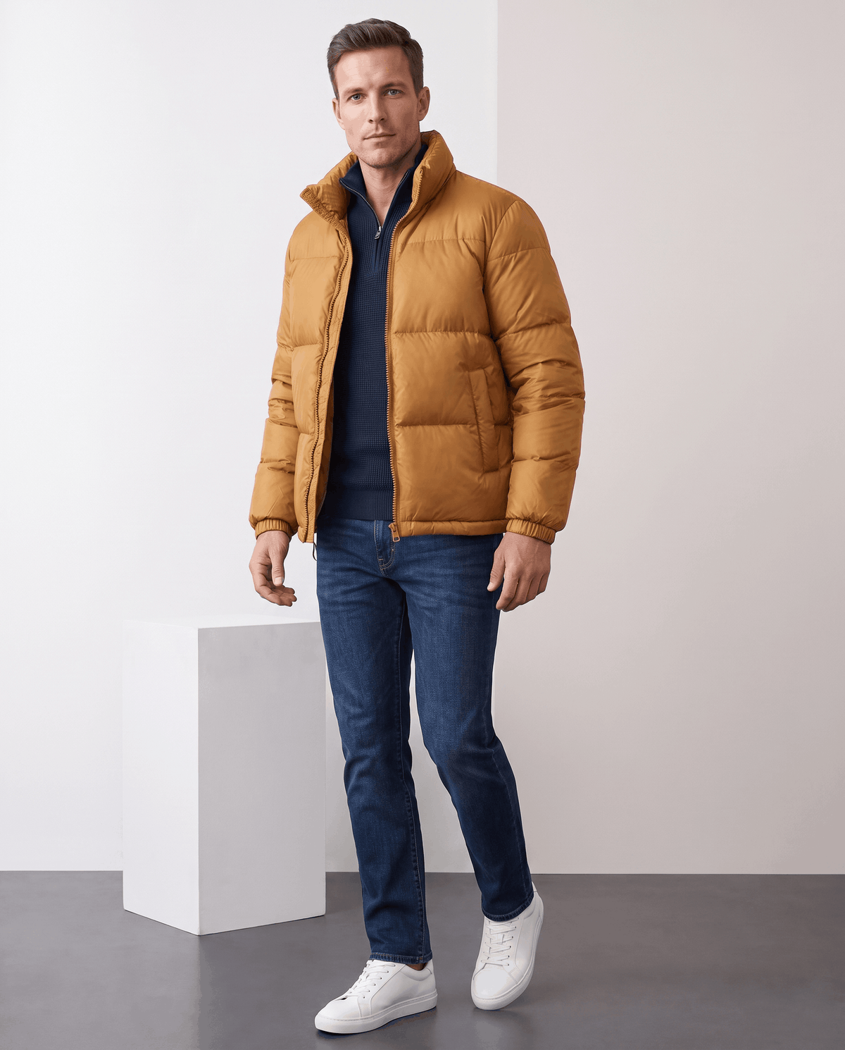 Man wearing caramel Salvador quilted puffer jacket with jeans, full-length front view