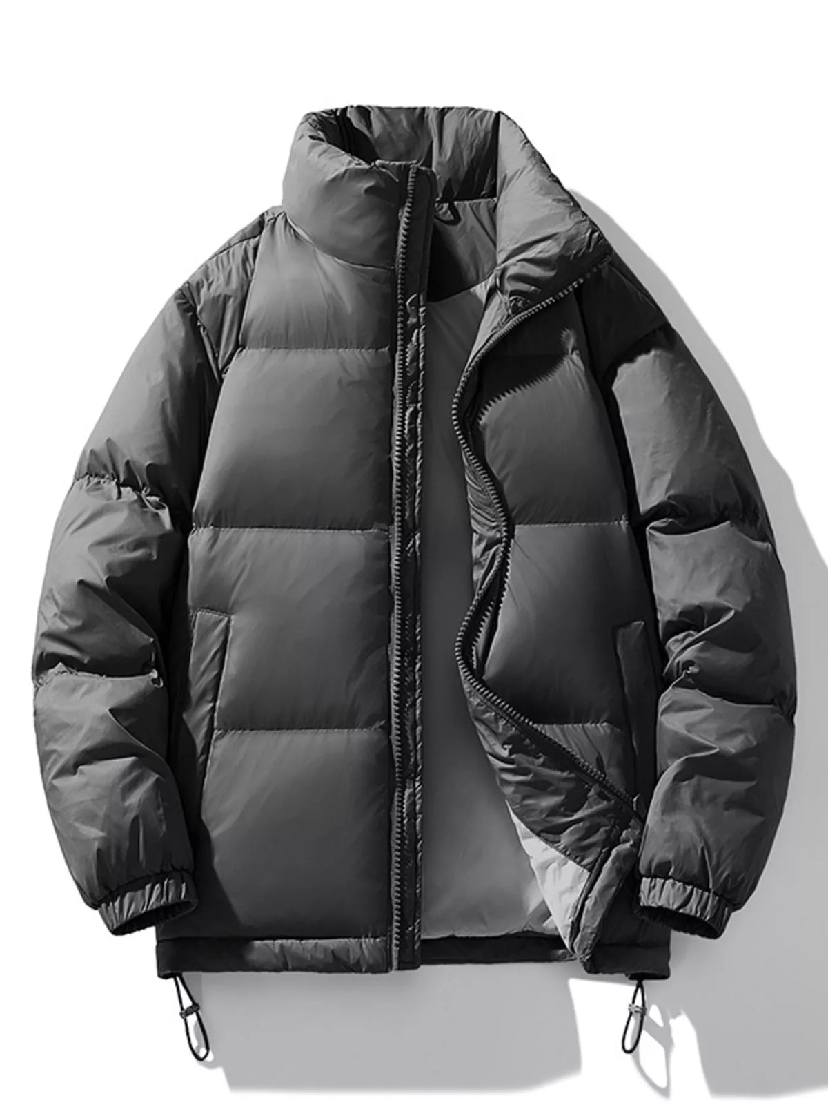 Dark gray Salvador quilted puffer jacket laid flat and unzipped, front view