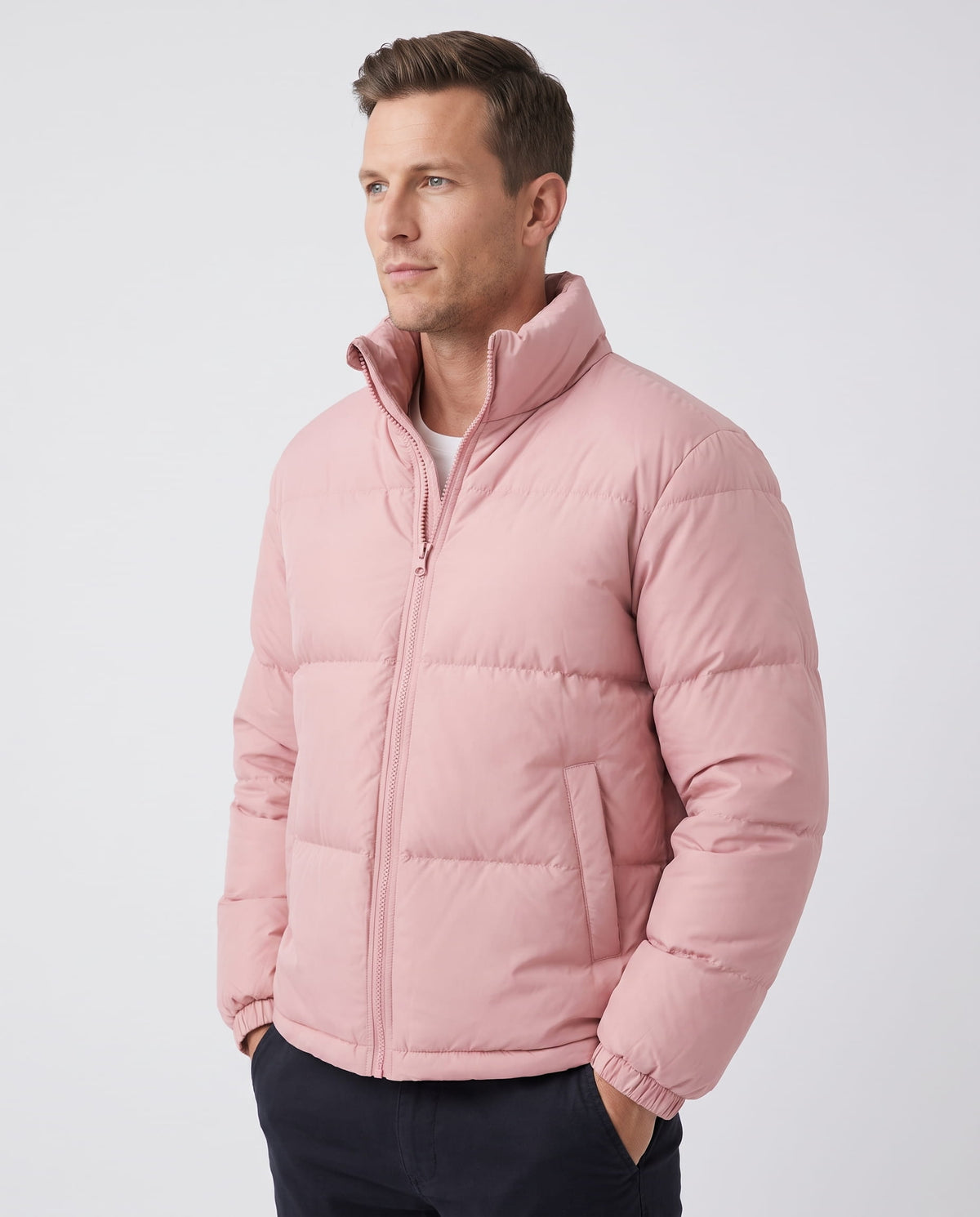 Man wearing dusty pink Salvador quilted puffer jacket, front view with full-zip and high collar
