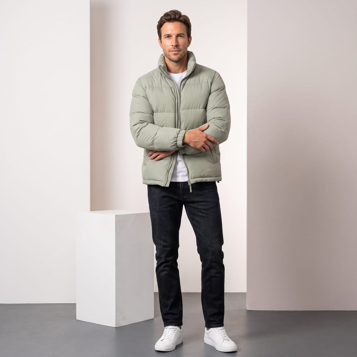 Man wearing sage Salvador quilted puffer jacket with dark trousers, full-length front view