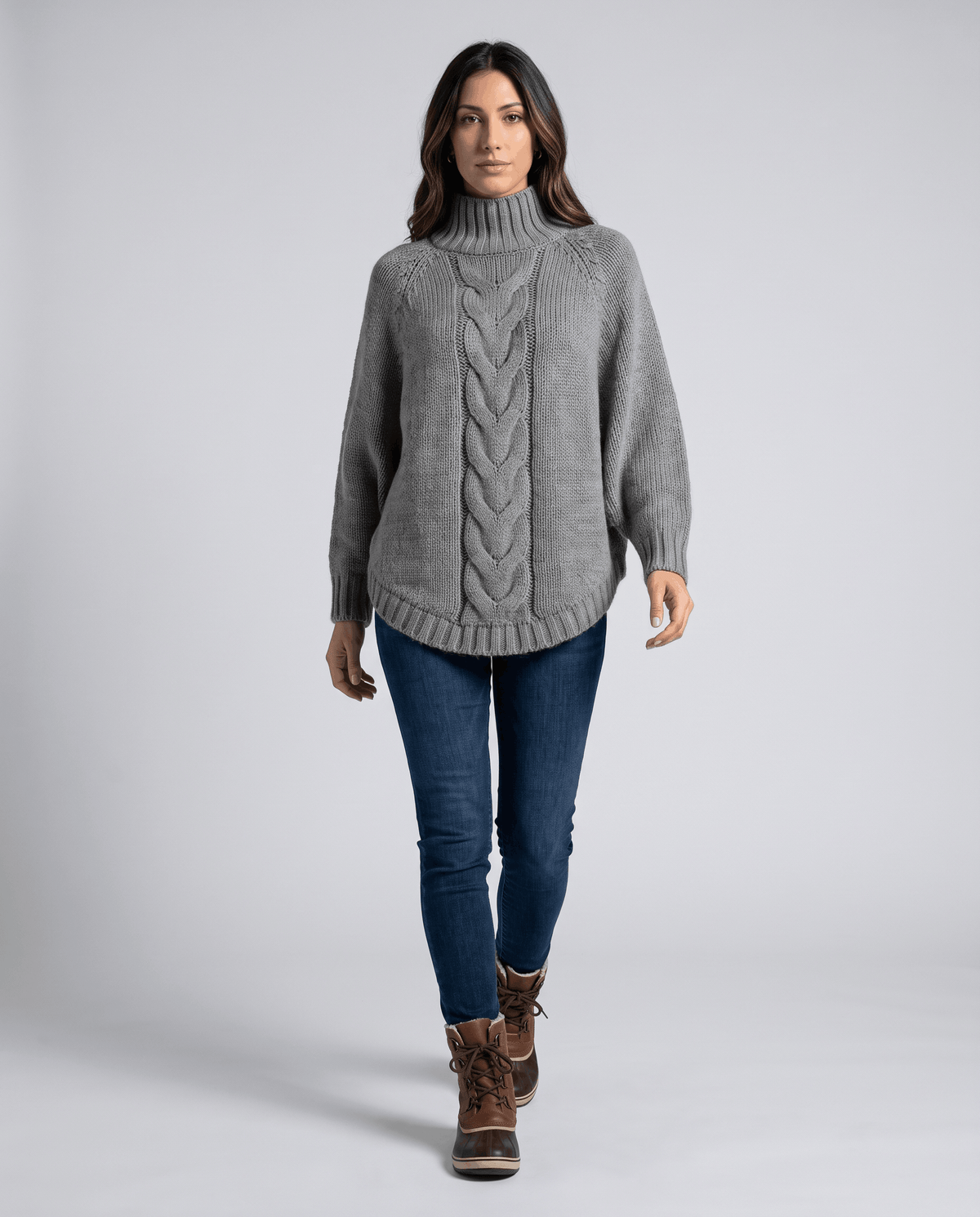 Full-length view of gray turtleneck sweater with jeans and ankle boots