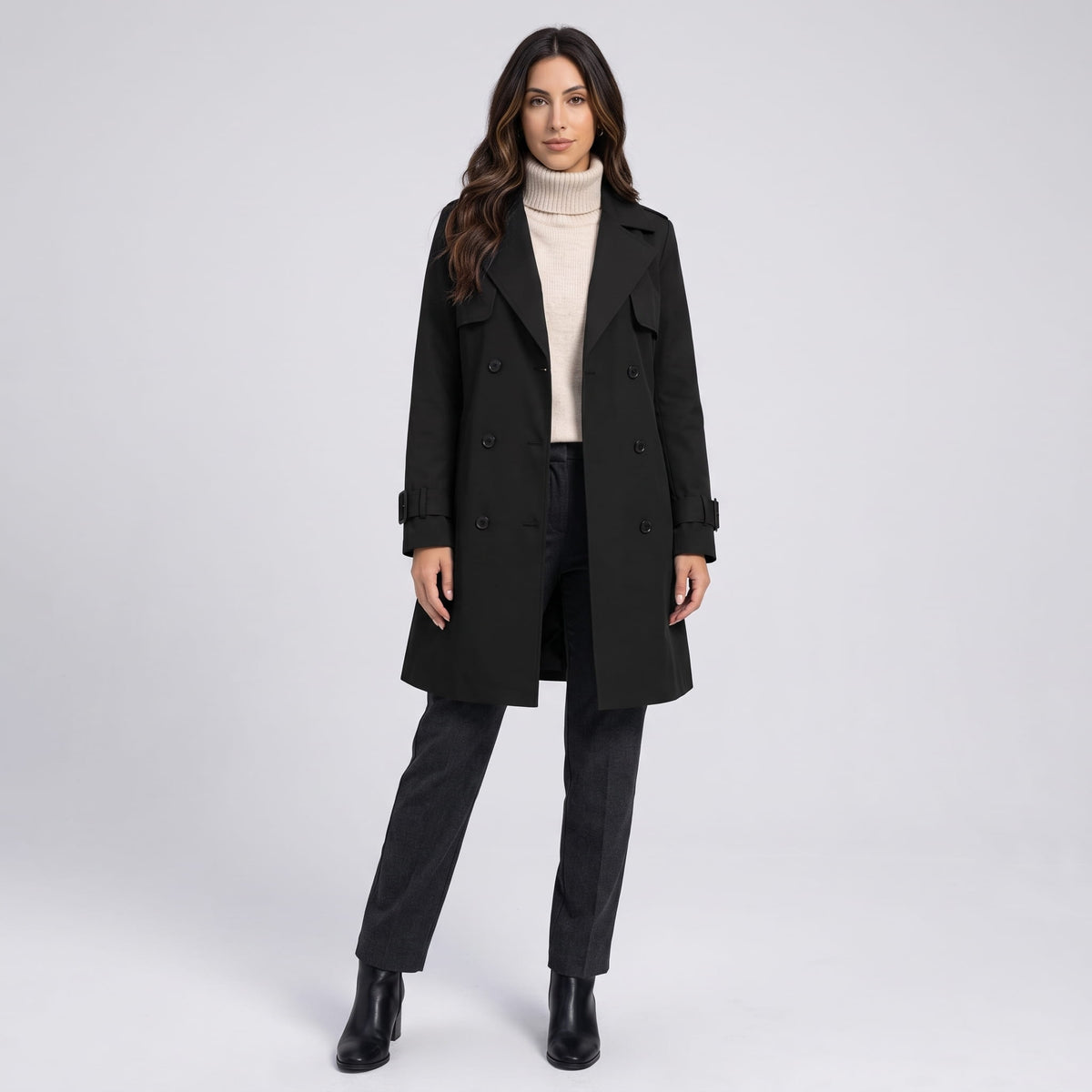 Full-length view of black coat with gray trousers and black ankle boots