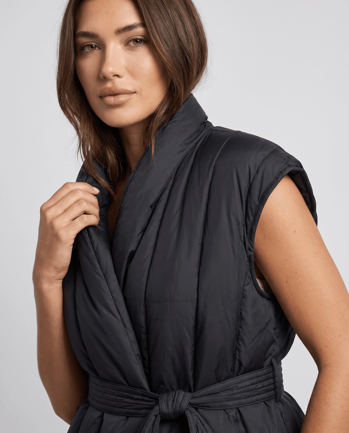 Close-up of black vest shawl collar and channel quilting on shoulder