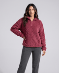 Front view of burgundy cable-textured fleece pullover with gray pants