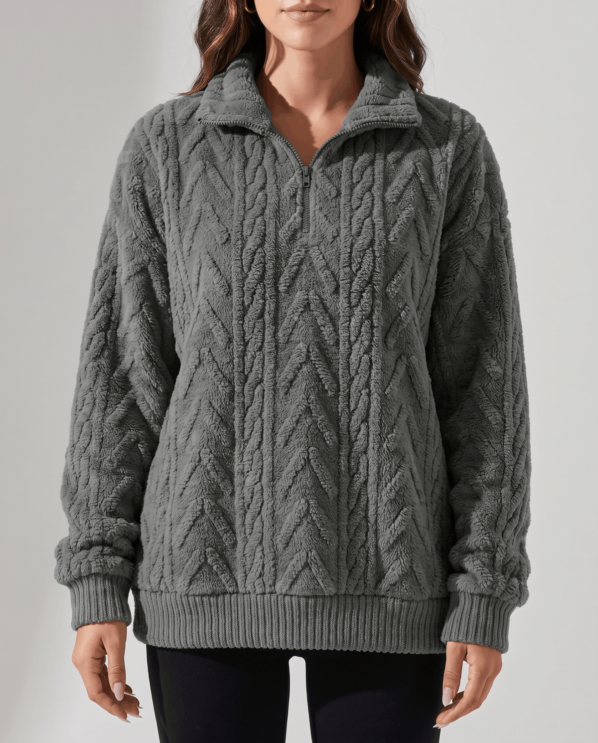Cropped front view of dark gray cable fleece pullover with ribbed hem