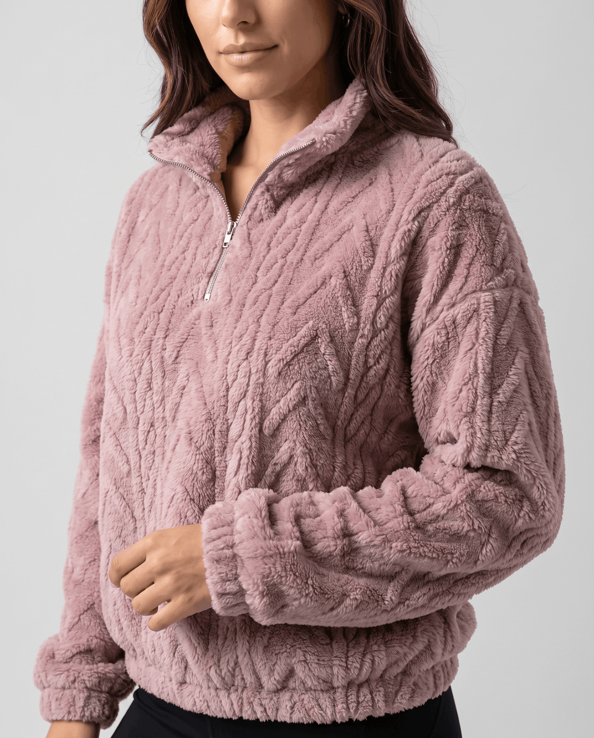 Cropped front view of light purple plush quarter-zip with banded hem