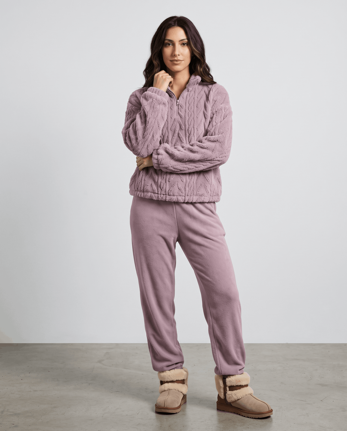 Full-length view of light purple pullover with matching mauve joggers and slippers