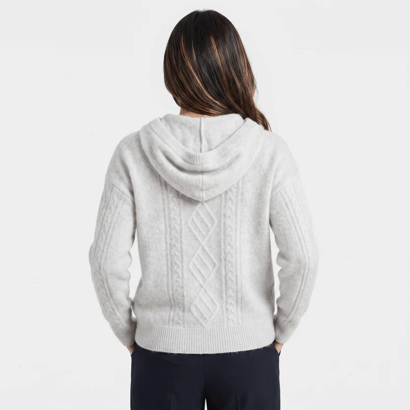Back view of light gray hooded sweater with cable knit panel and hood