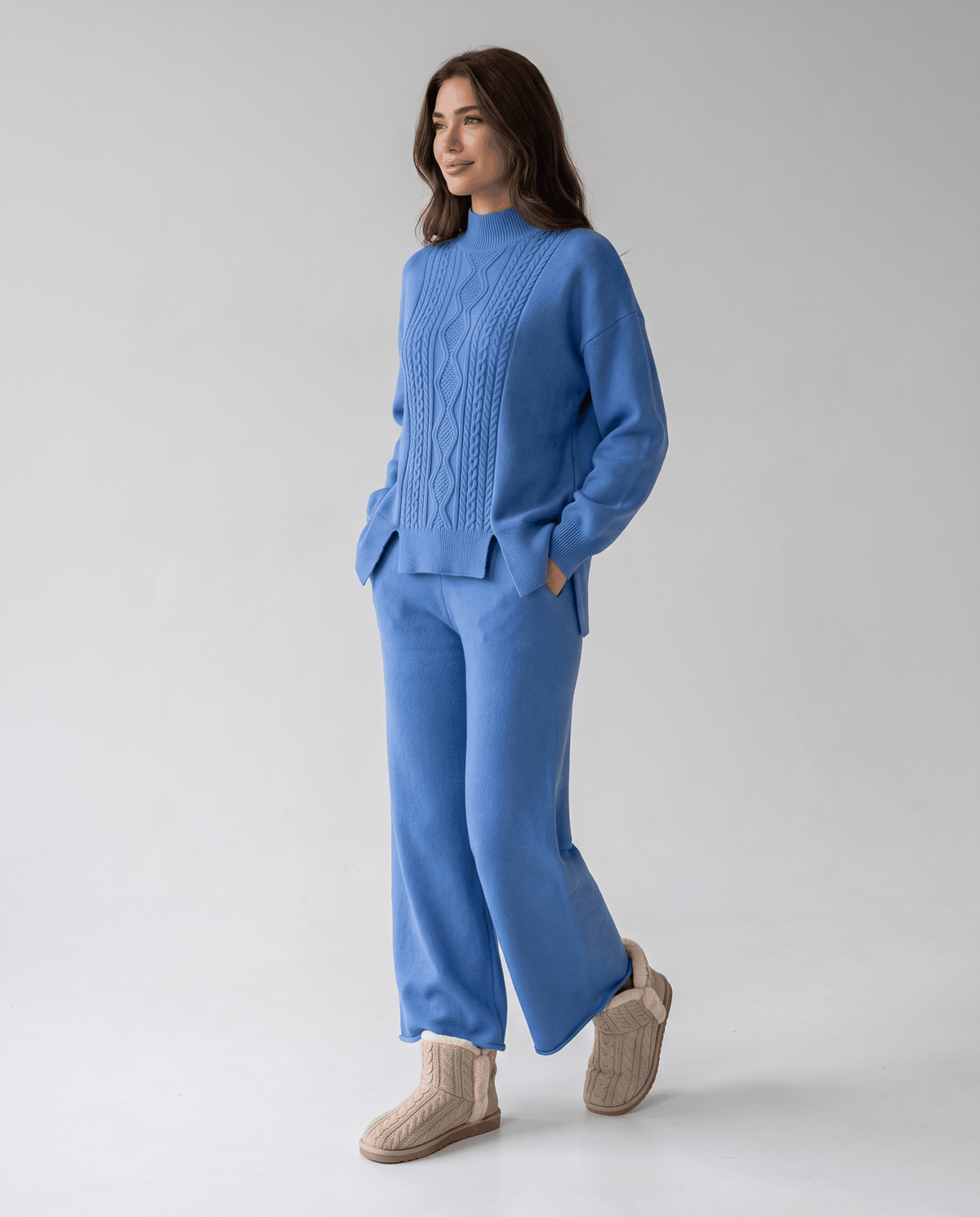 Blue cable knit pullover with mock neckline and wide-leg pants, front view