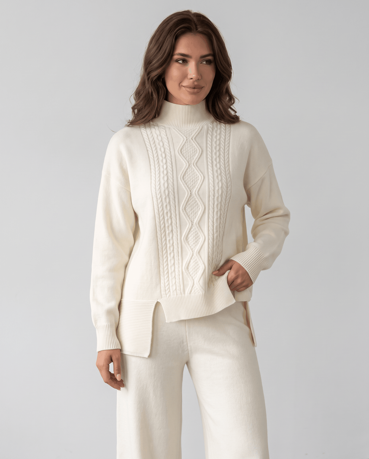 Cream cable knit pullover with mock neckline, three-quarter front view
