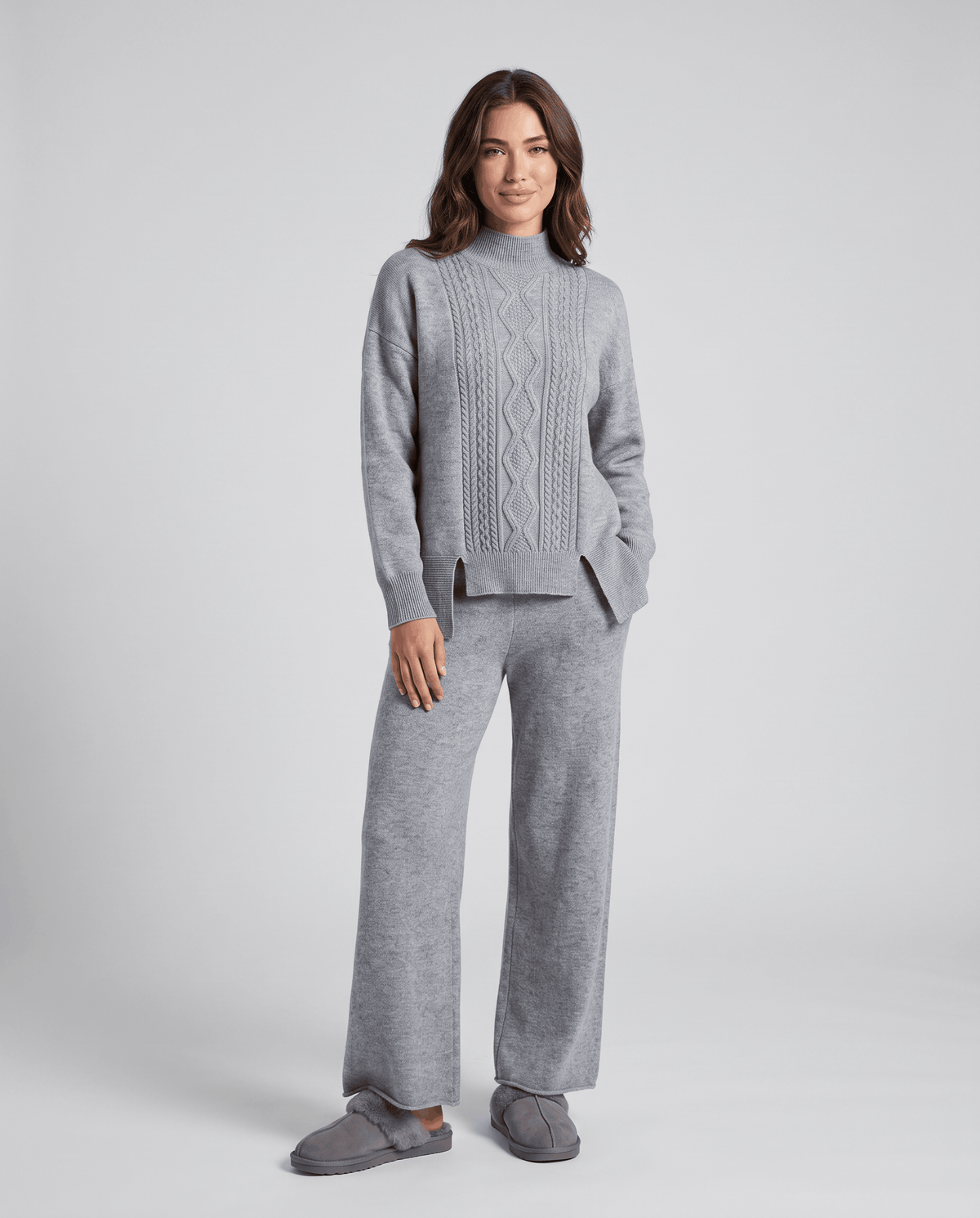 Grey cable knit pullover with mock neckline and wide-leg pants, front view