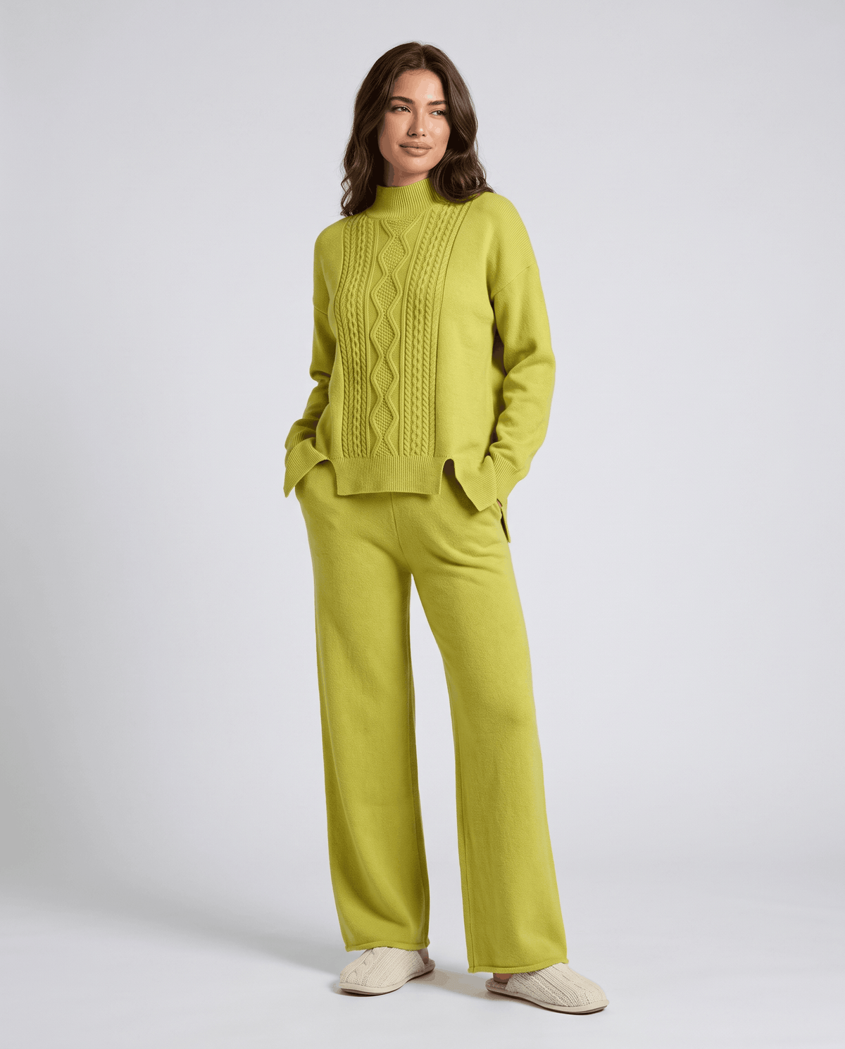 Lime green cable knit pullover and wide-leg pants, front view
