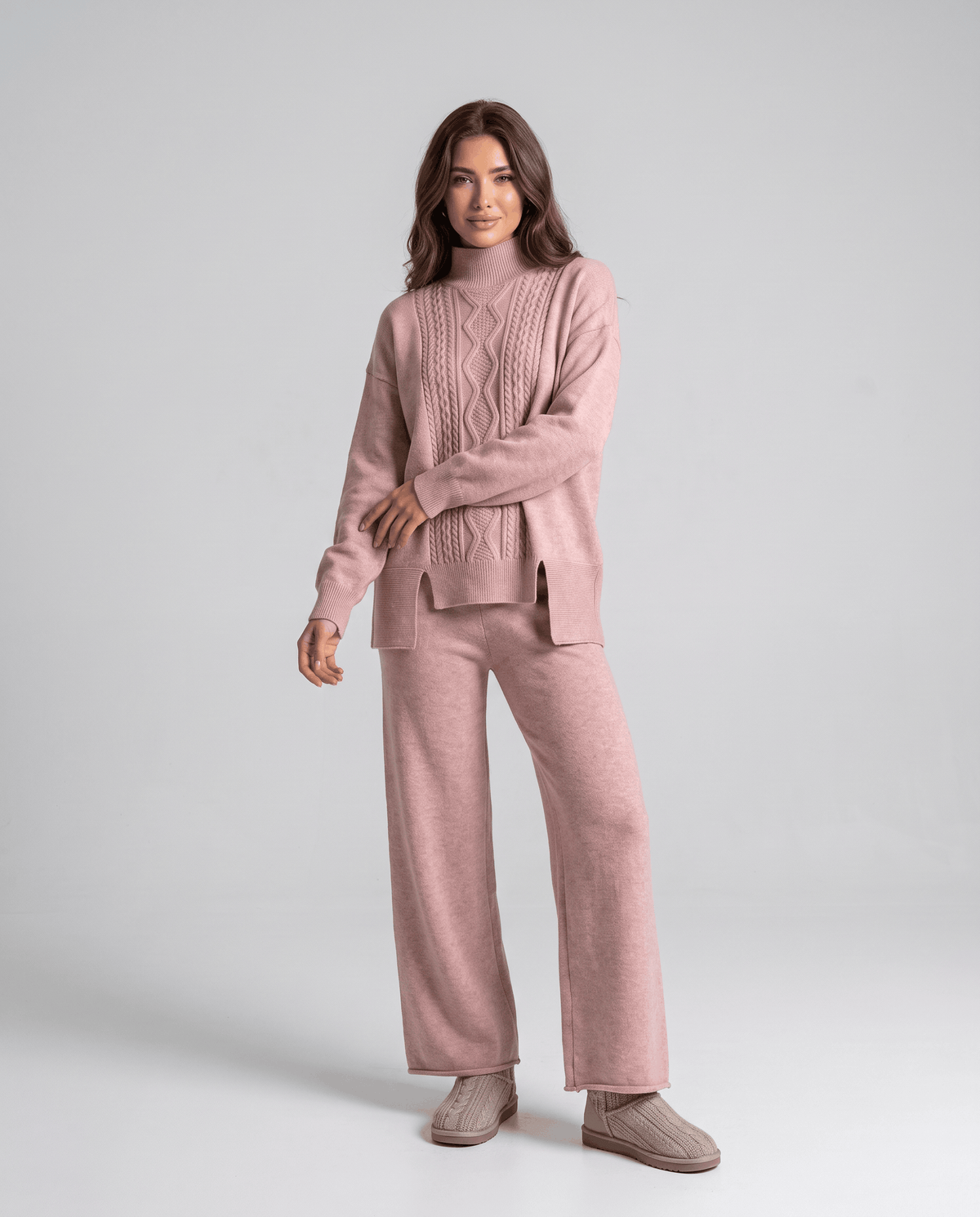 Pink cable knit pullover with mock neckline and wide-leg pants, front view